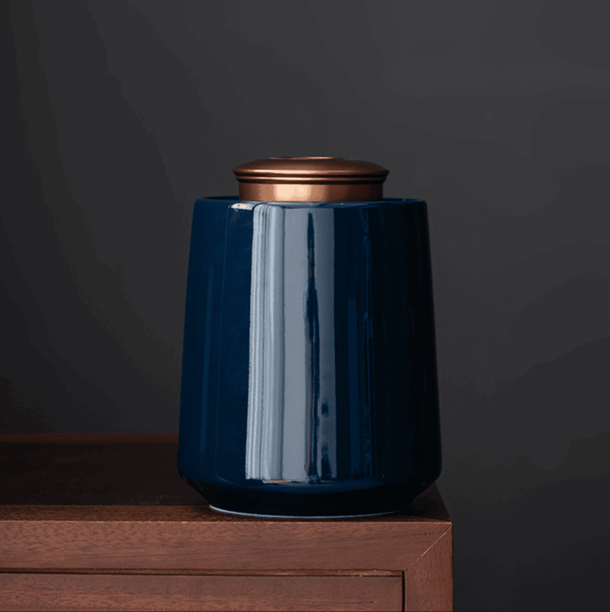 Airtight kitchen storage container with brass finish lid side profile against a soft neutral background
