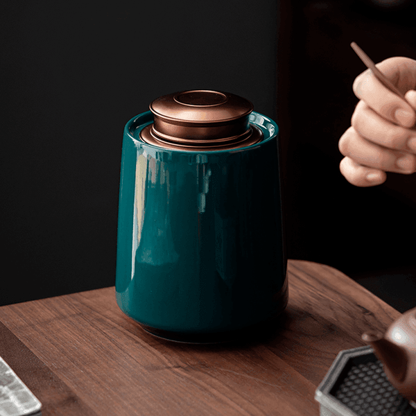 Airtight kitchen storage container with brass finish lid on a light styled tabletop