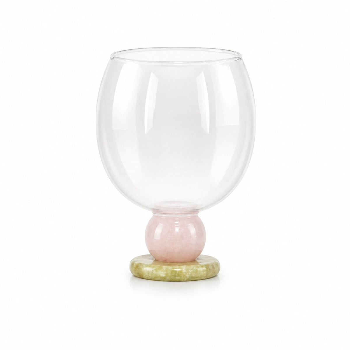 Balloon drinking glass with a rose quartz bead on a pale green base