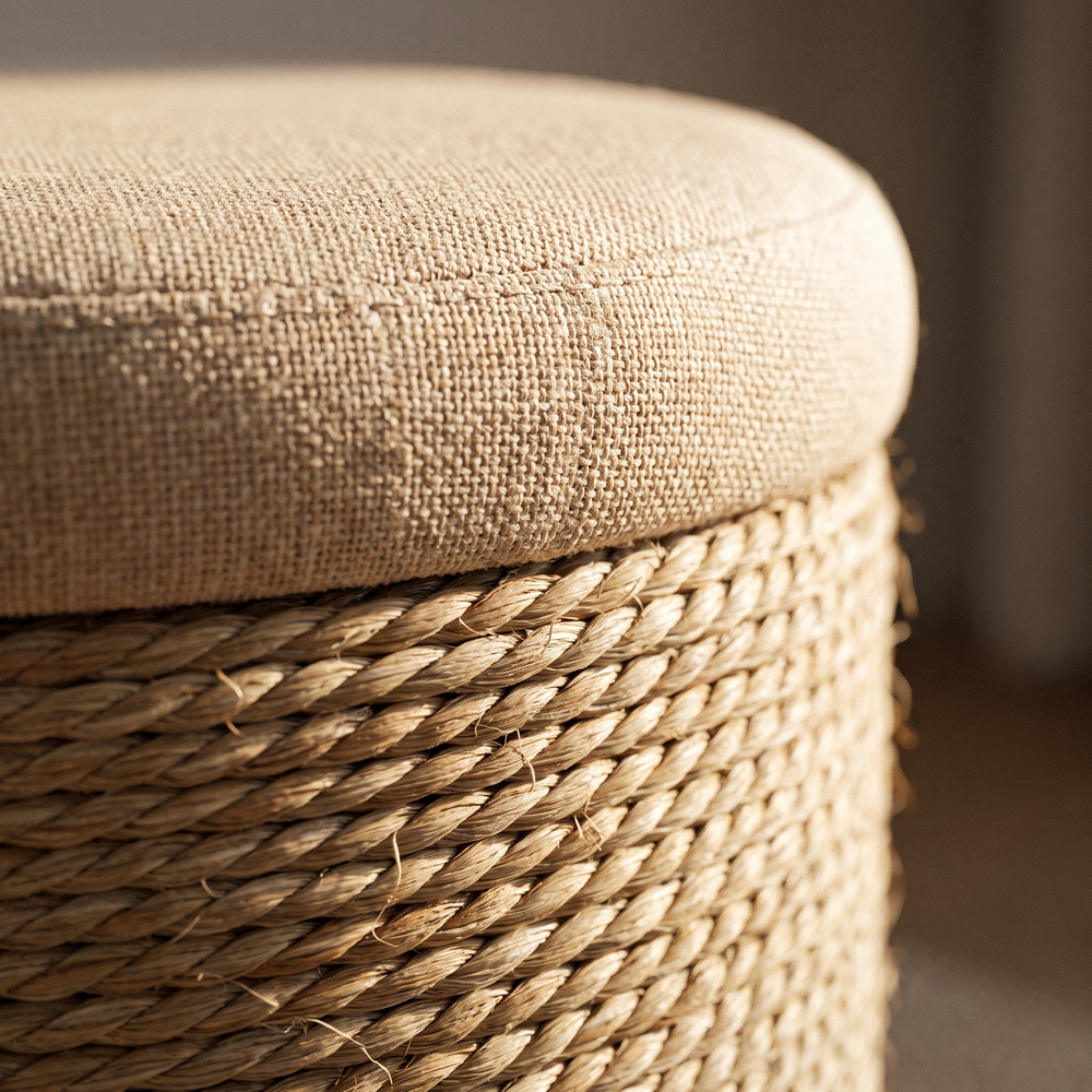 Close view of the padded lid and twisted weave of the storage ottoman