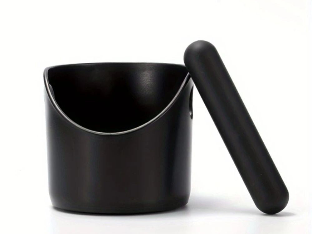 Black espresso knock box with the knock bar lifted out