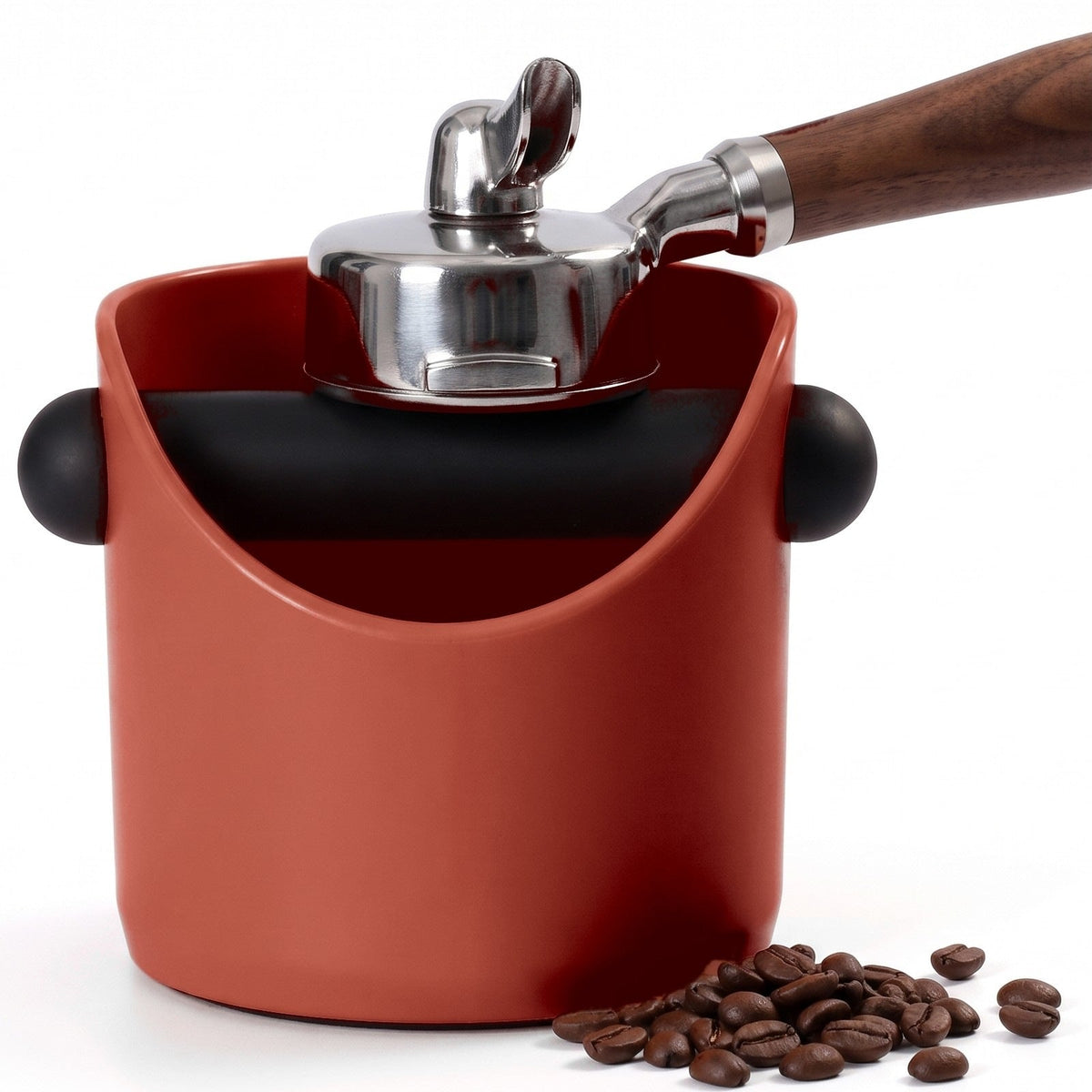 Brew espresso knock box in Brick Red with a portafilter tapping on the knock bar