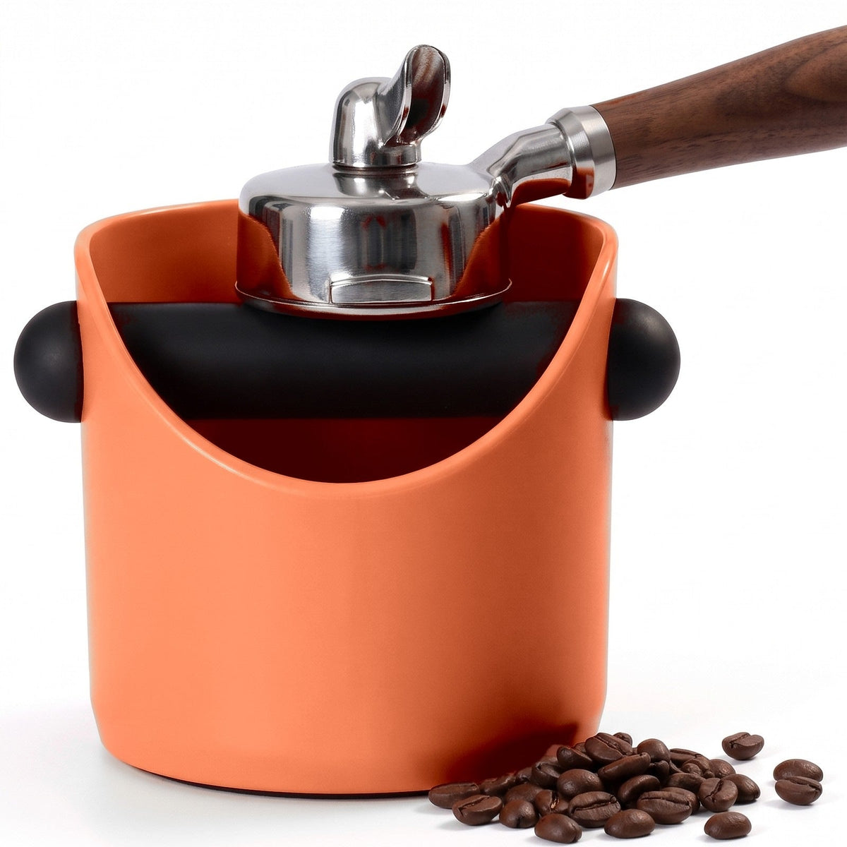 Brew espresso knock box in Coral Orange with a portafilter tapping on the knock bar
