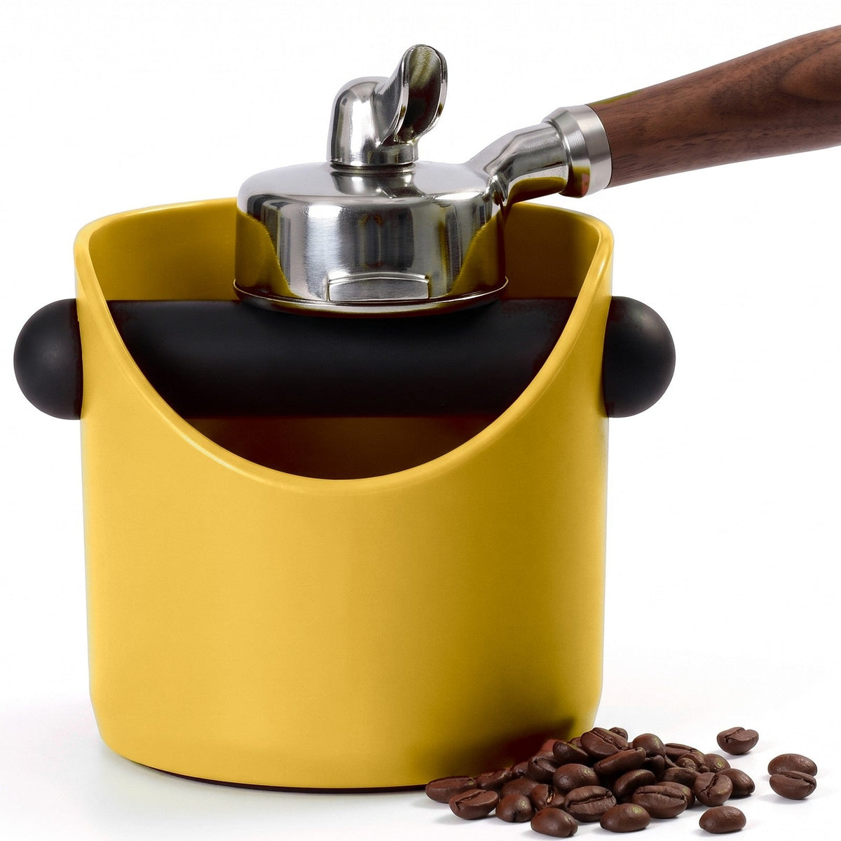 Brew espresso knock box in Sunshine Yellow with a portafilter tapping on the knock bar