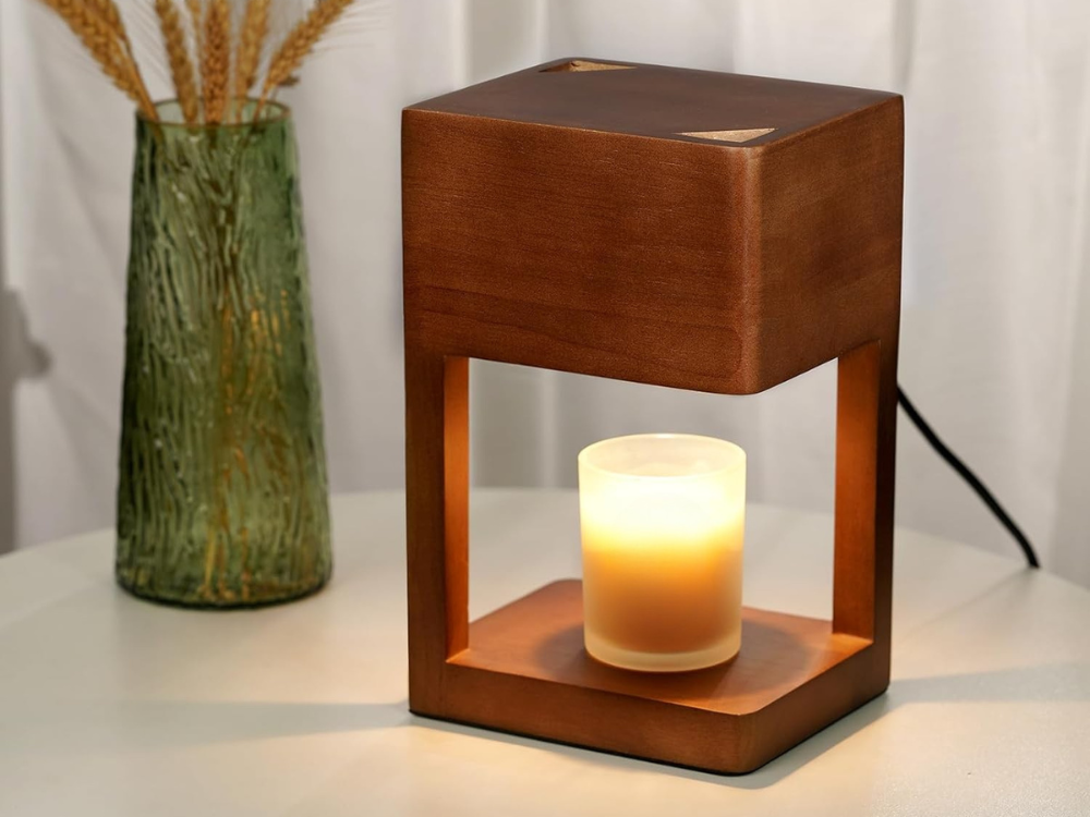 Dark brown wood candle warmer lamp warming a jar candle on a round side table