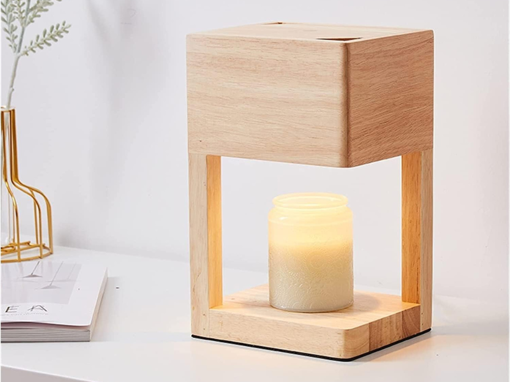 Light brown wood candle warmer lamp with a jar candle on its base
