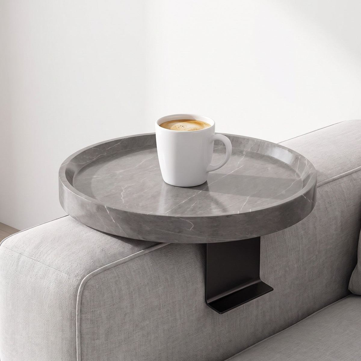 Gray Marble clip-on tray on a sofa arm with a mug of coffee