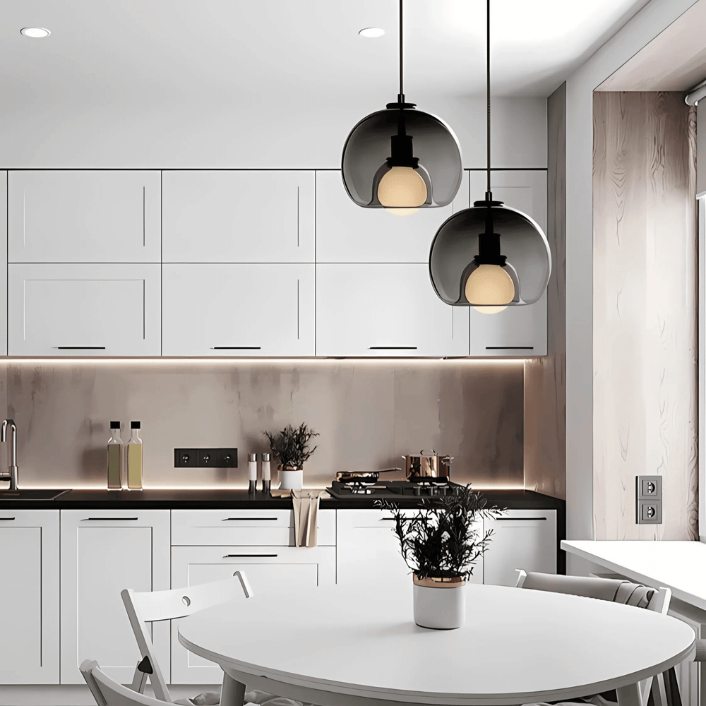 Two smoke gray Clyde pendant lights over a kitchen table