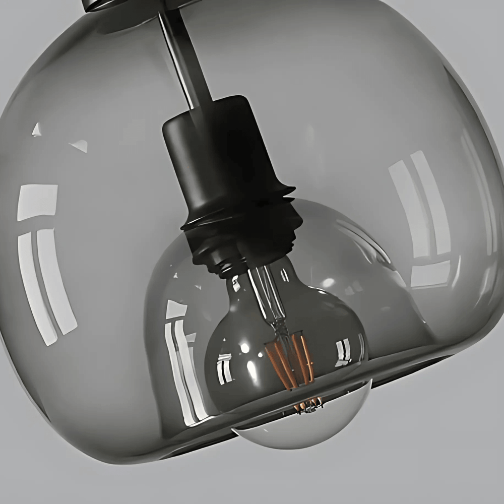 Close view of the smoke gray Clyde glass shade and bulb