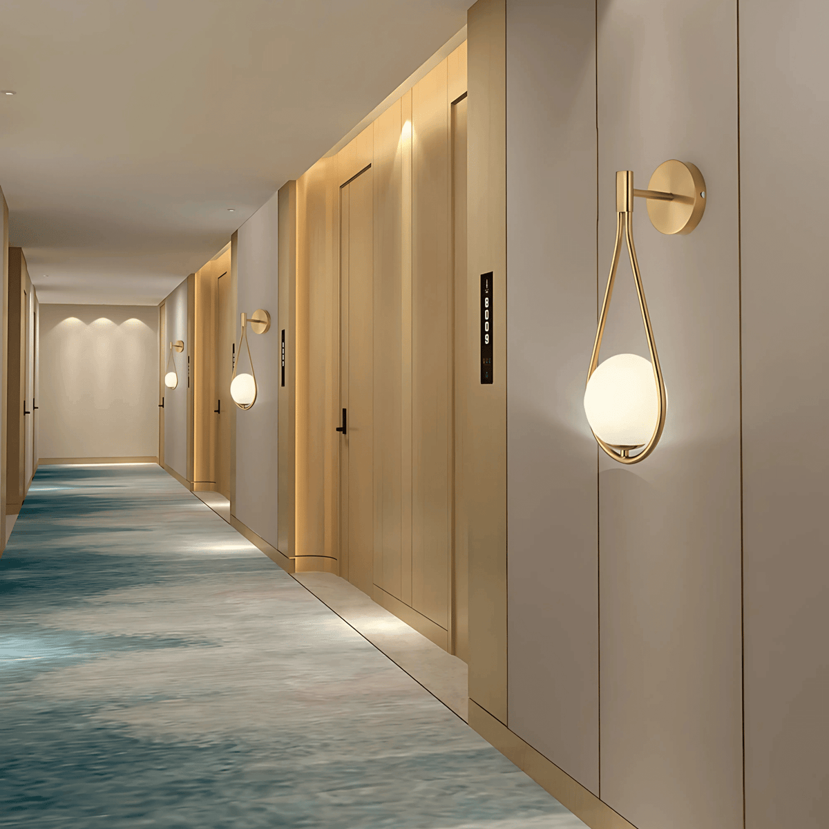 Brass globe wall sconces lighting a long hallway