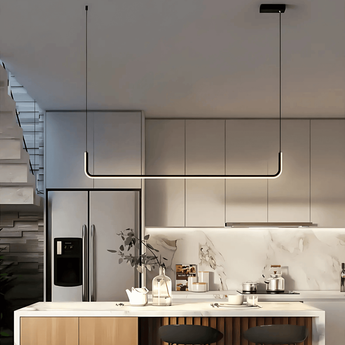 Black Dumont linear pendant light in a kitchen beside a staircase