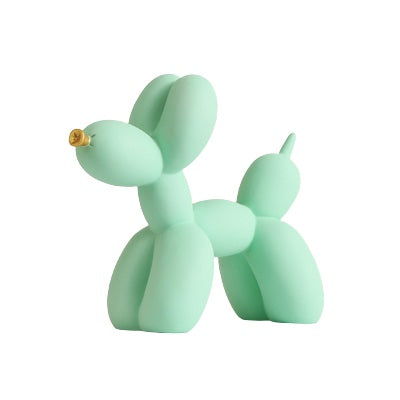 Green matte balloon dog sculpture on a white background