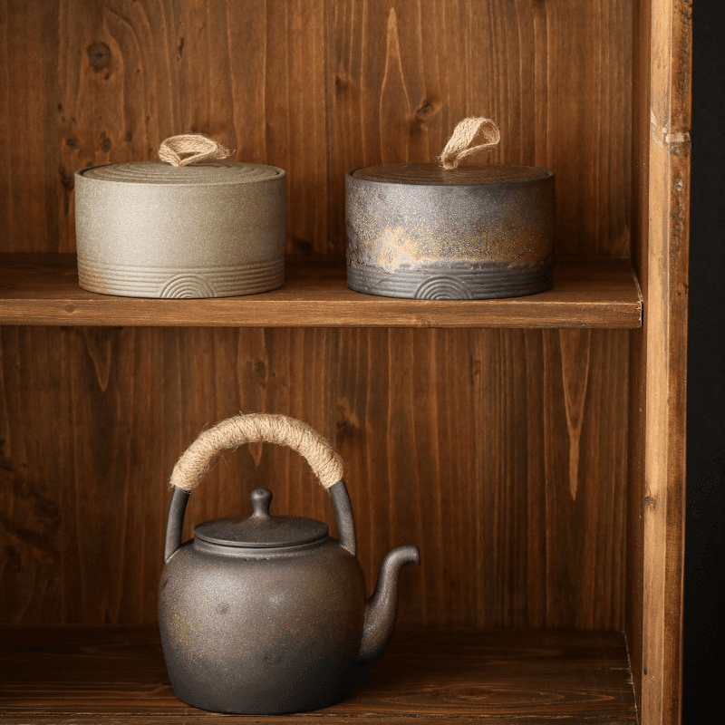 Handmade Japanese ceramic storage jar with hemp rope handle top down view showing the opening