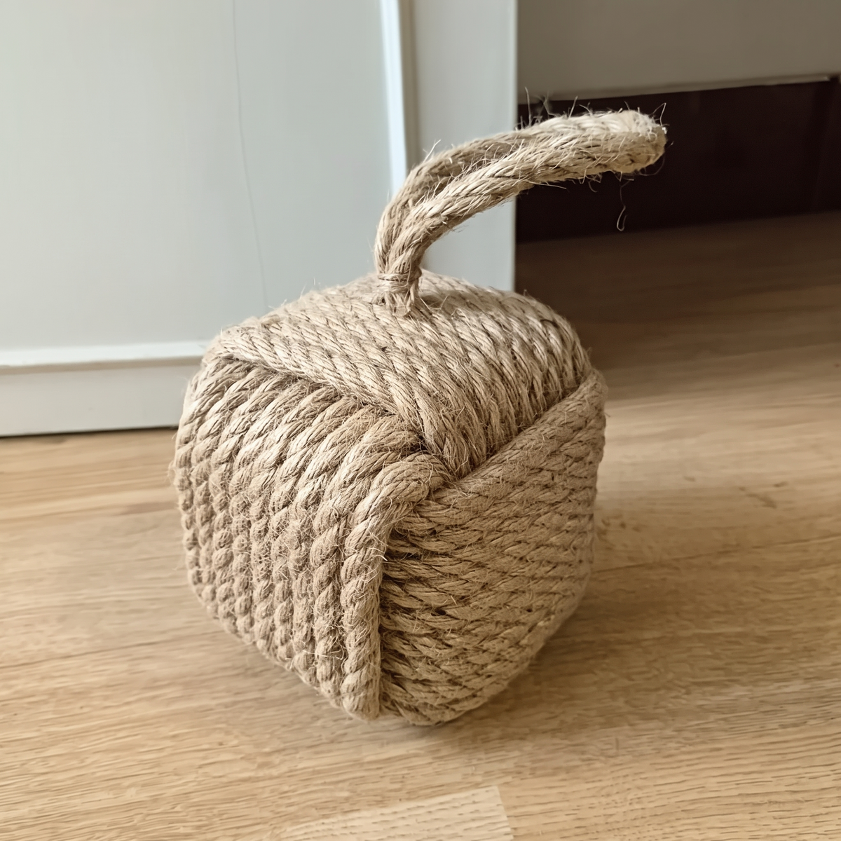 Natural brown rope cube door stop with a loop handle