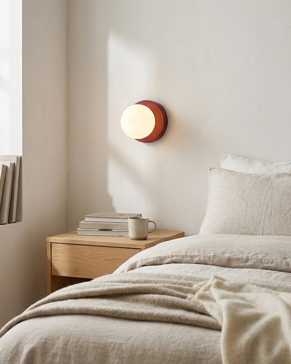 Nordic frosted globe wall light as a bedside sconce
