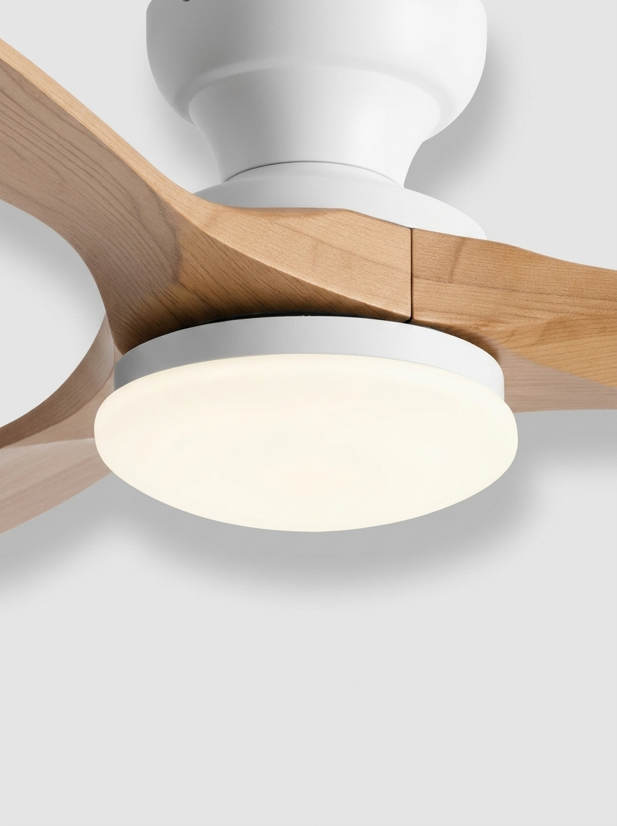 Close-up hero shot of the natural wood ceiling fan with white housing