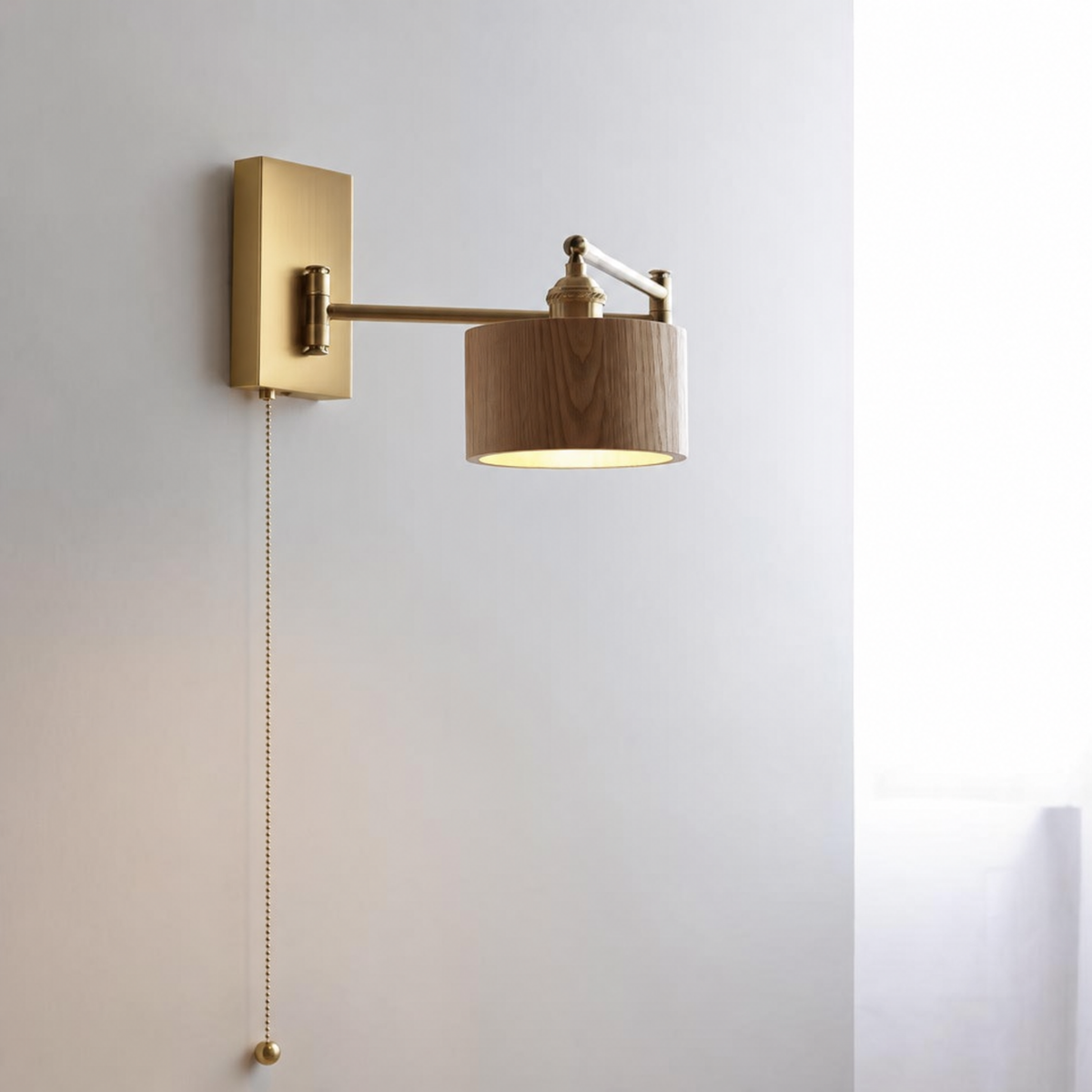 Round shade ash wall sconce with brass wall plate and pull chain