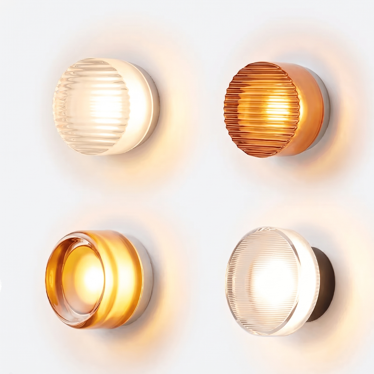 Four Hera LED wall sconces switched on against a white wall