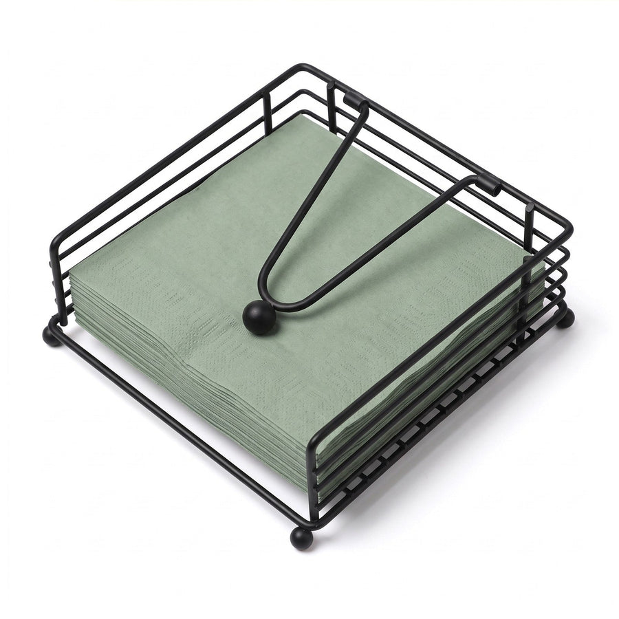 Black iron wire napkin holder holding a stack of paper napkins