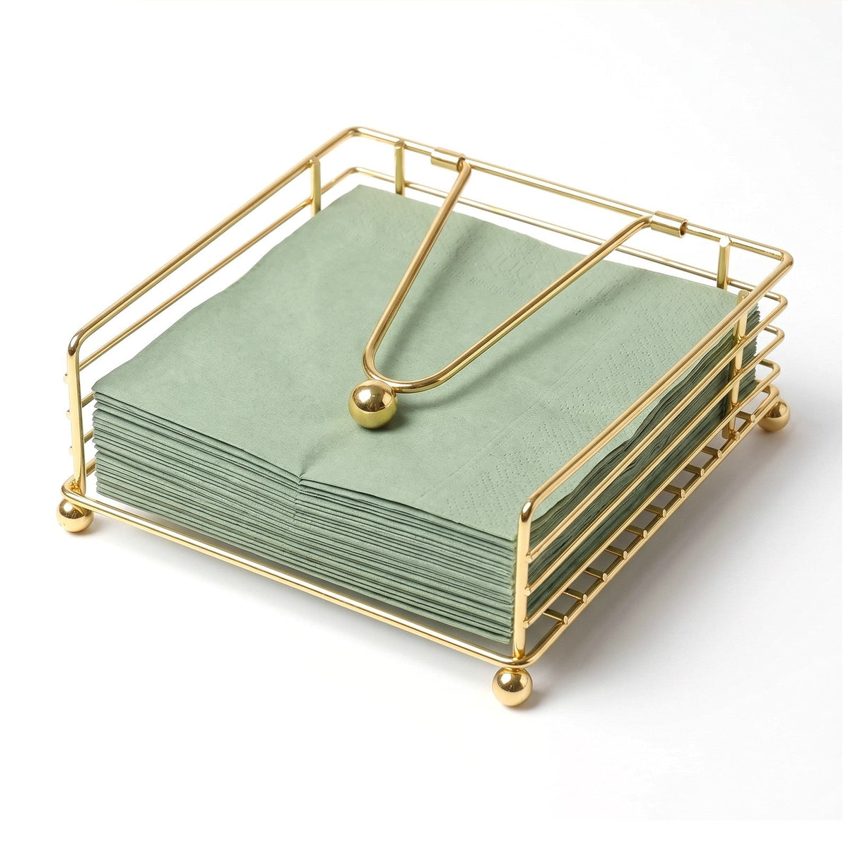Gold iron wire napkin holder holding a stack of paper napkins