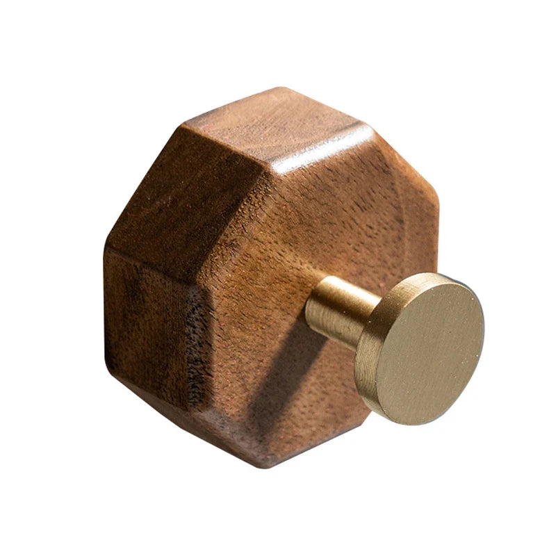 Walnut octagon wall hook with a brushed brass finish peg