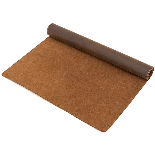 Coffee brown crazy horse leather desk mat half rolled up on white