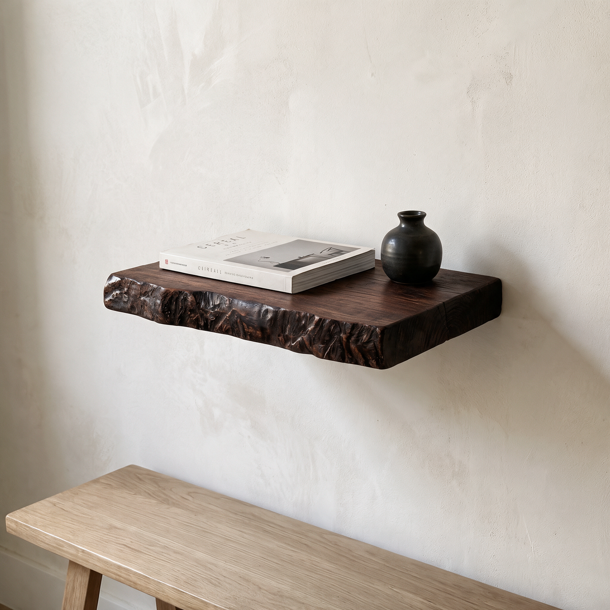 Brown live edge floating shelf, 12 inches wide, above an entryway bench