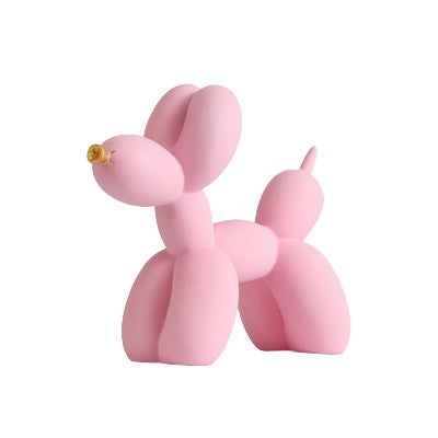 Pink matte balloon dog sculpture on a white background