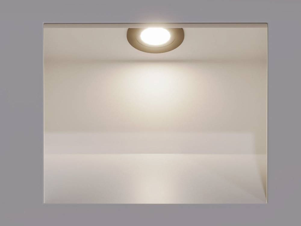 Square recessed LED stair light with the downlight on in a gray wall