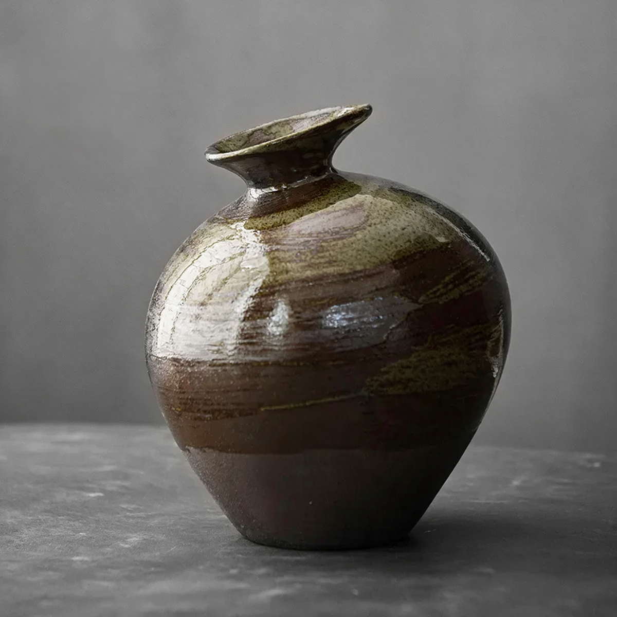 Green glaze ceramic bud vase jar with olive and bronze bands