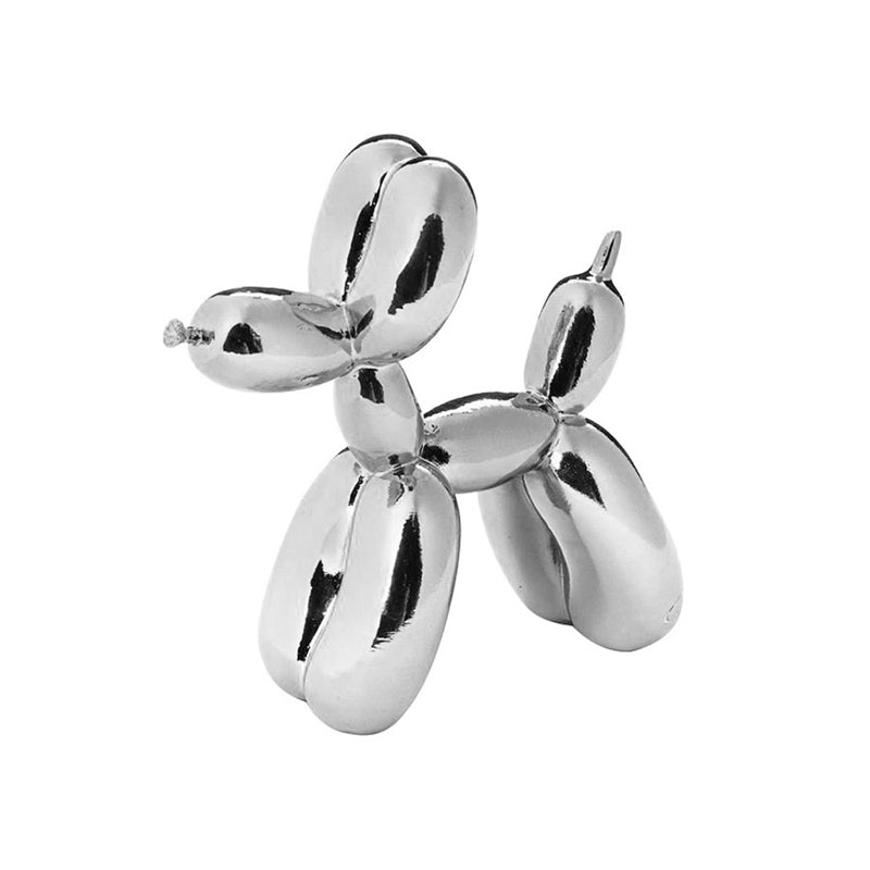 Silver glossy balloon dog sculpture on a white background