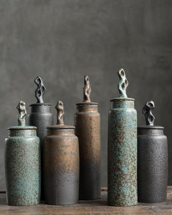 Handmade stoneware tea caddy with airtight ceramic lid on a light styled tabletop