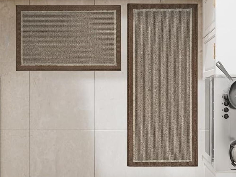 Two Strata kitchen rugs on a kitchen floor seen from above