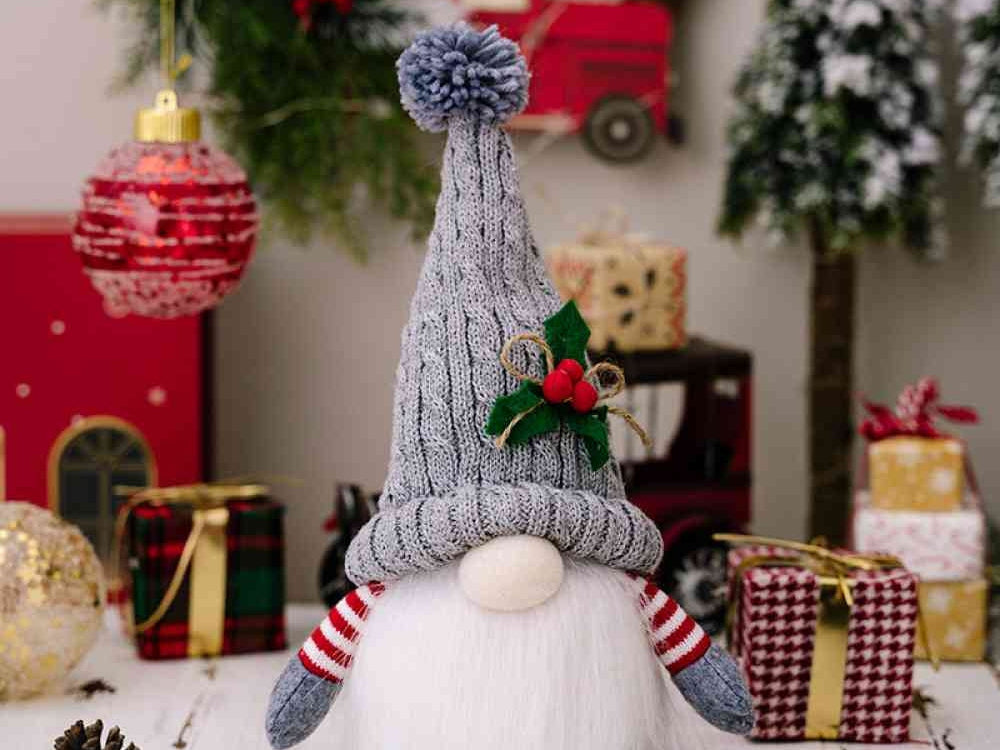 Gray knit hat and fluffy beard of the light-up Christmas gnome