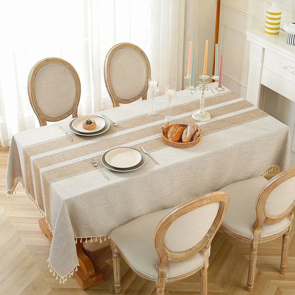 Oatmeal tablecloth set for brunch between round back dining chairs