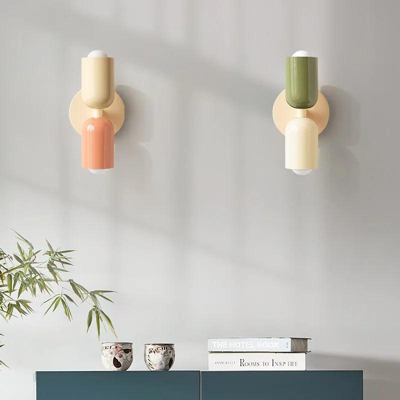 Pastel up down wall light shown in a styled interior setting